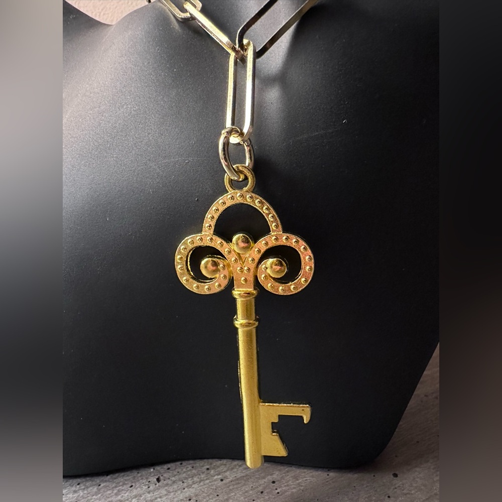 Gold Key Pendant on an 18” Sugarfix Gold Tone Paperclip Necklace.